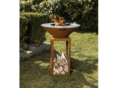 Barbecue et plancha FYRO en INOX coloris rouille oxydé avec stockage des bûches par dessous Feu du jardin